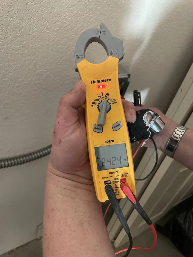 Voltage testing with clamp meter during Electrical Installation Services in New Lenox